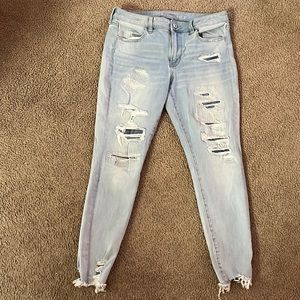 American Eagle like new Skinny Jeans size 12 with patches behind rips
